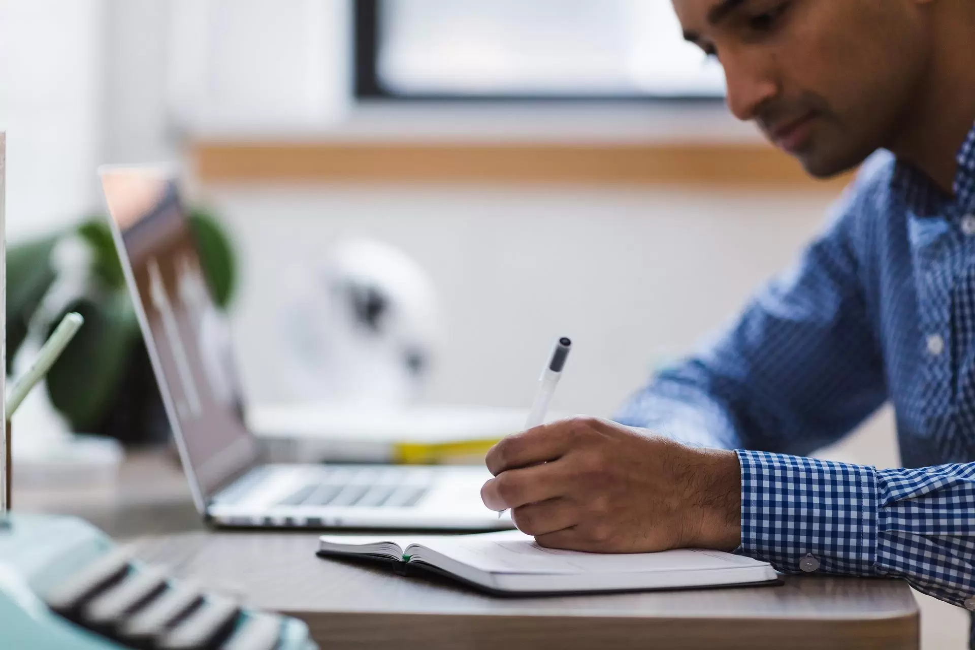 man viewing files on laptop