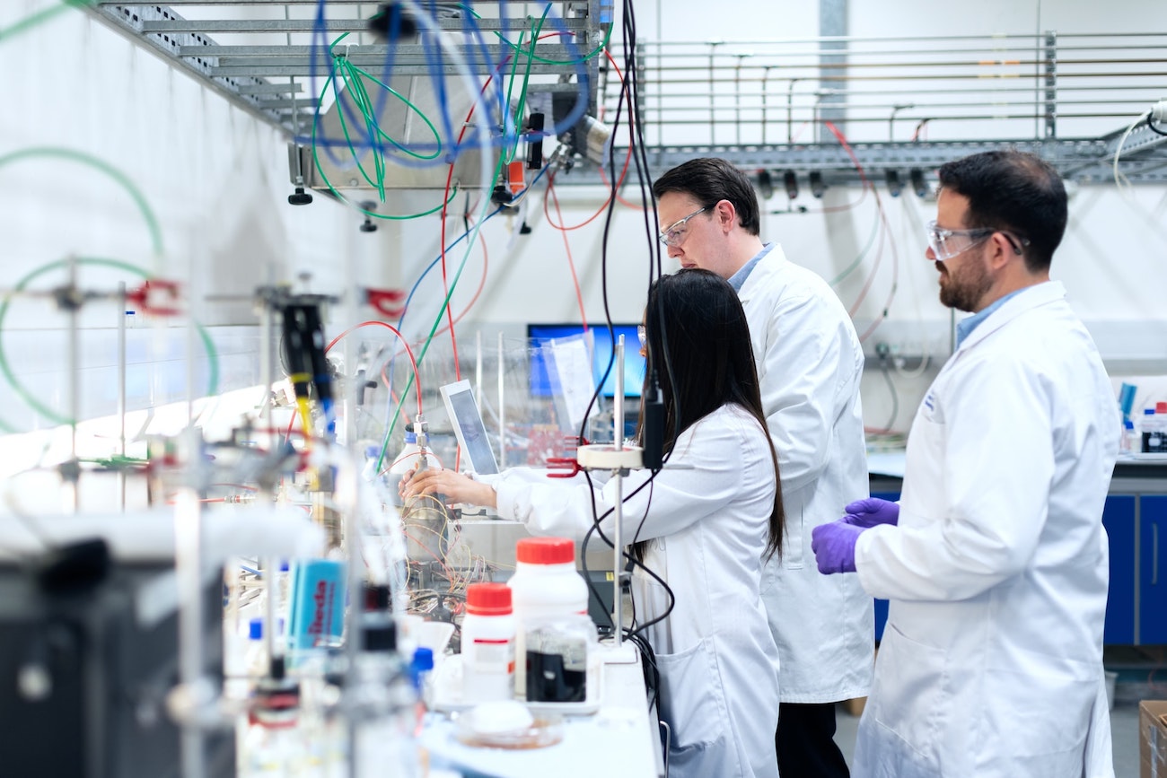 three researchers in a lab