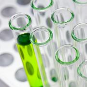 test tubes filled with green liquid