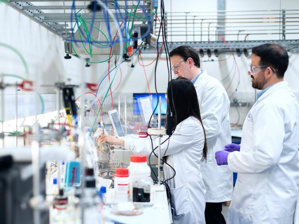 researcher with glass flask